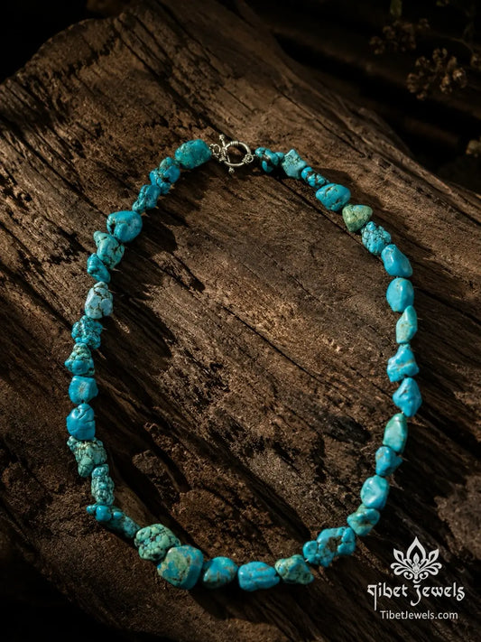 The Untamed Sky turquoise nugget necklace from a second angle, highlighting the asymmetric graduated stone arrangement.