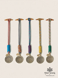 Five handwoven Tibetan Nine Palaces & Eight Trigrams brass bagua charms in five cord colors.