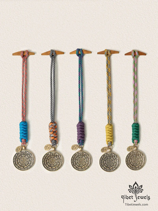 Five handwoven Tibetan Nine Palaces & Eight Trigrams brass bagua charms in five cord colors.