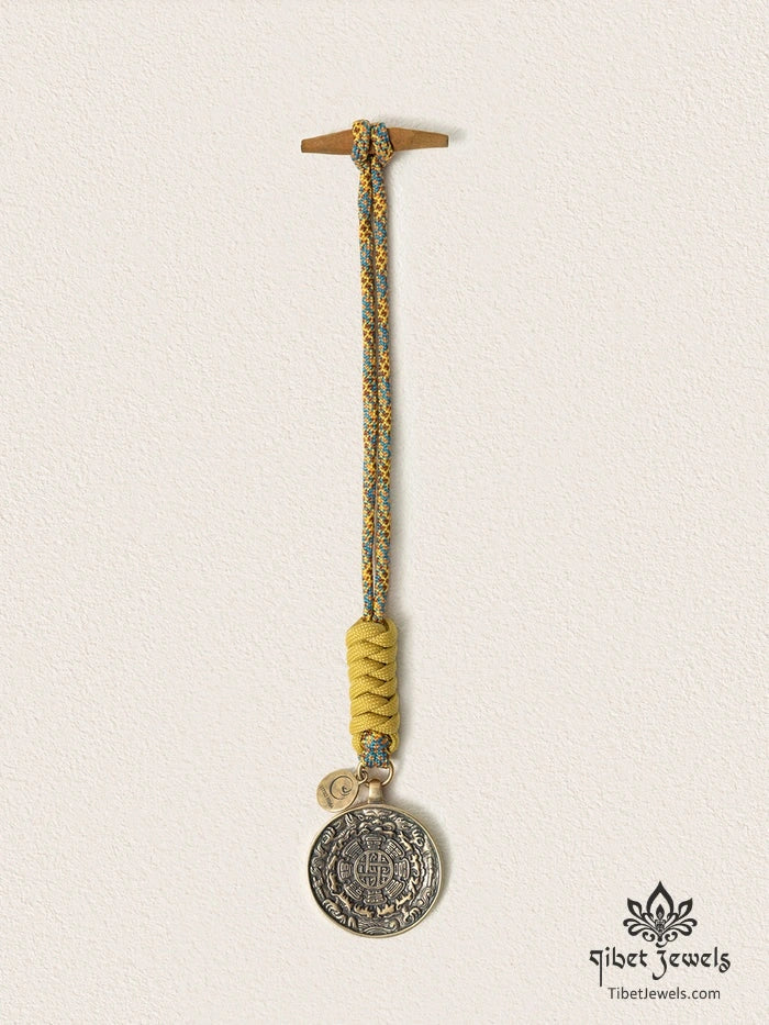 Close-up of antiqued brass bagua plaque with Eight Trigrams and zodiac