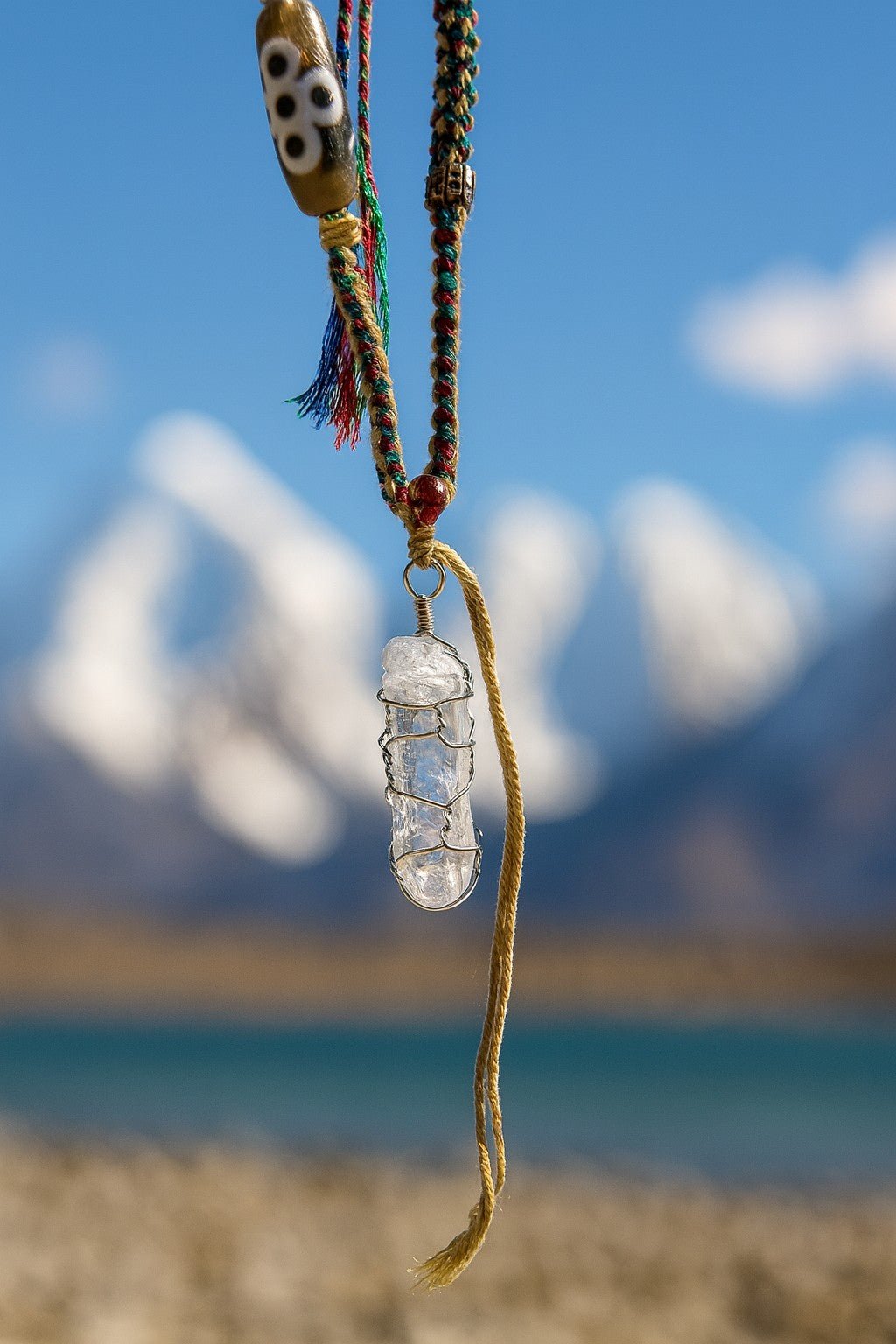 Raw Himalayan clear quartz crystal amulet for energy healing and meditation.