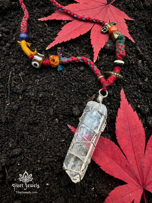 Handwoven Tibetan spirit cord necklace featuring an uncut Himalayan raw crystal pendant, brass Vajra, old Dzi, and Yak bone Chitipati.