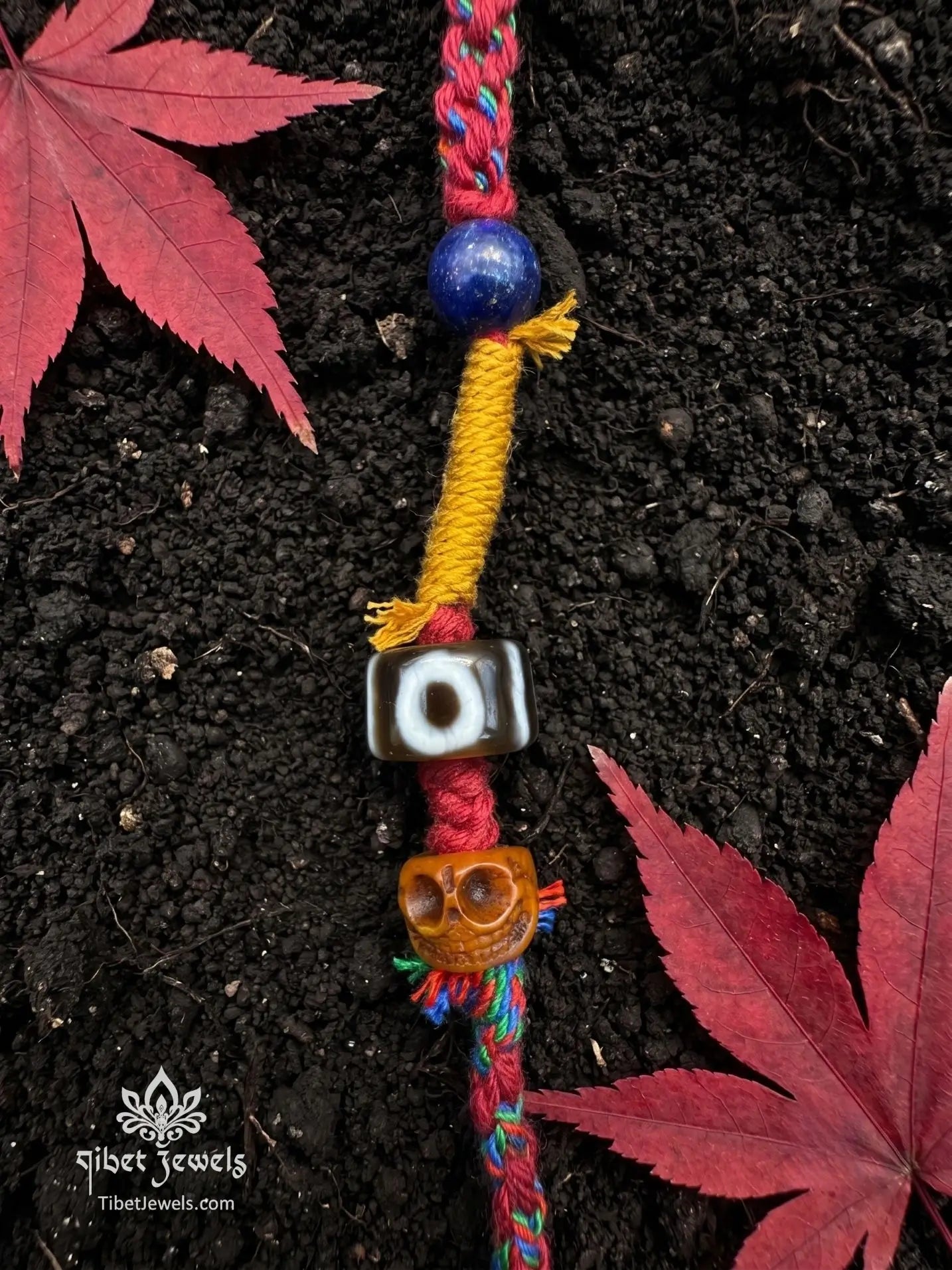 Handwoven Tibetan spirit cord necklace featuring an uncut Himalayan raw crystal pendant, brass Vajra, old Dzi, and Yak bone Chitipati.