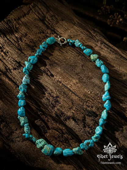 The Untamed Sky turquoise nugget necklace from a second angle, highlighting the asymmetric graduated stone arrangement.