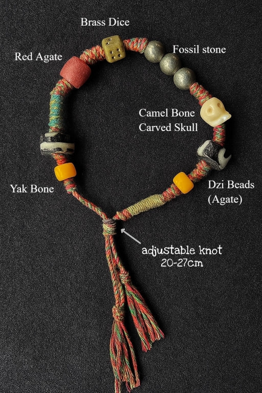 Ancient style Dzi bead woven into a traditional Tibetan dharma wheel bracelet.